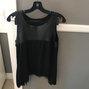 Black top with leather portion
